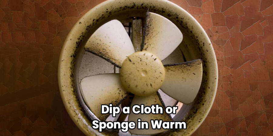 Dip a Cloth or
Sponge in Warm