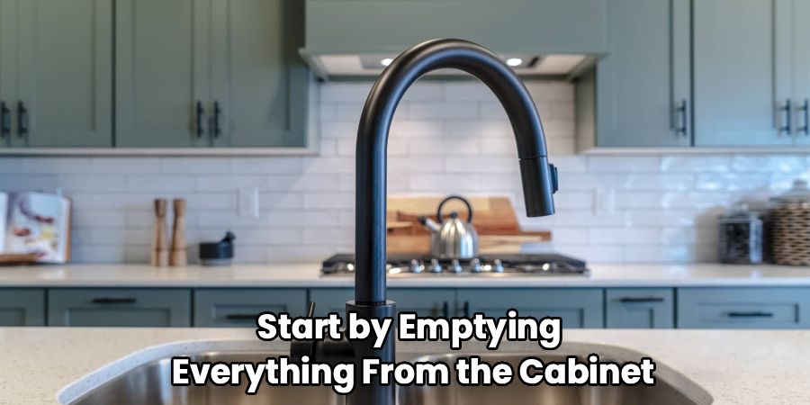 Start by Emptying
Everything From the Cabinet