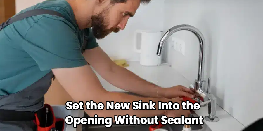 Set the New Sink Into the 
Opening Without Sealant