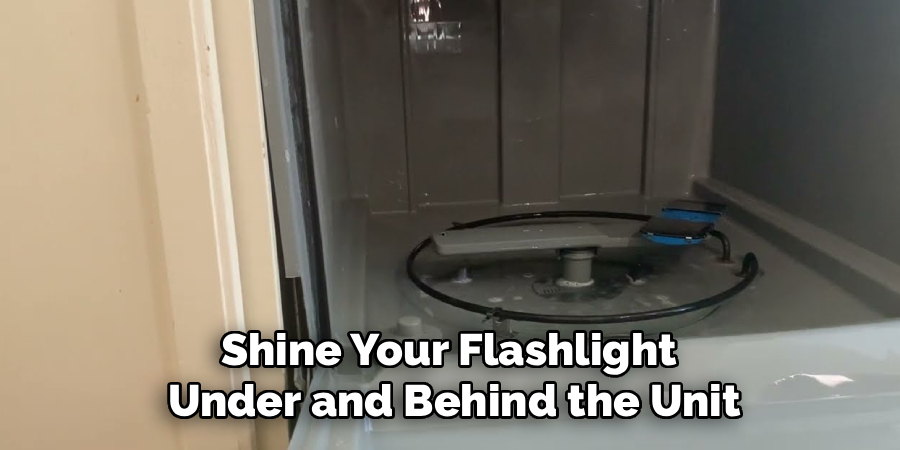 Shine Your Flashlight 
Under and Behind the Unit