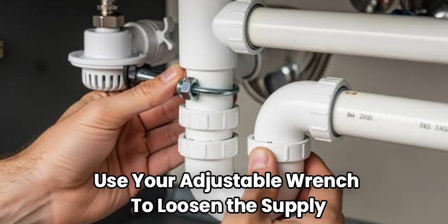 Use Your Adjustable Wrench
To Loosen the Supply