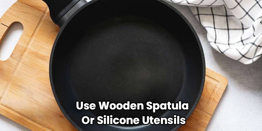 Use Wooden Spatula 
Or Silicone Utensils