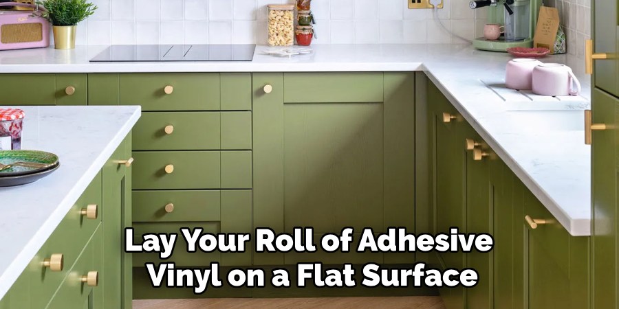 Lay Your Roll of Adhesive 
Vinyl on a Flat Surface