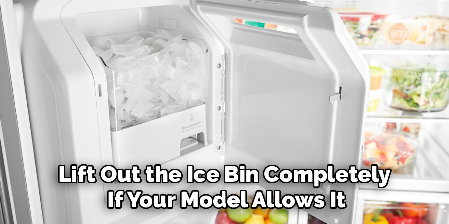 Lift Out the Ice Bin Completely 
If Your Model Allows It