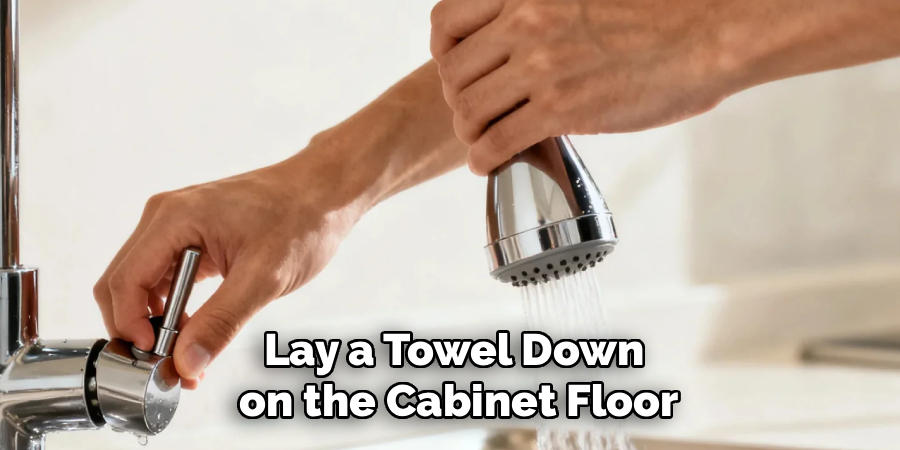 Lay a Towel Down
 on the Cabinet Floor
