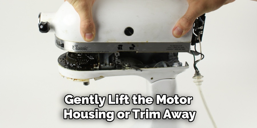 Gently Lift the Motor Housing or Trim Away