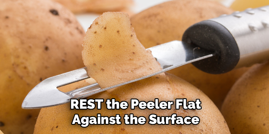 REST the Peeler Flat
Against the Surface